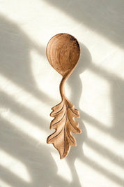 Artisan oak leaf wooden spoon carved from doussie wood