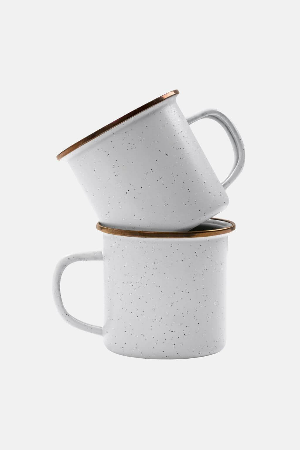 Two handcrafted white speckled enamel cups against white background