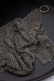 Close-up of chainmail scrubber for cast iron cleaning