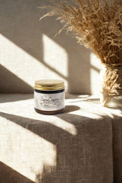 Sinus Congestion Salve jar beside dried grasses in natural sunlight