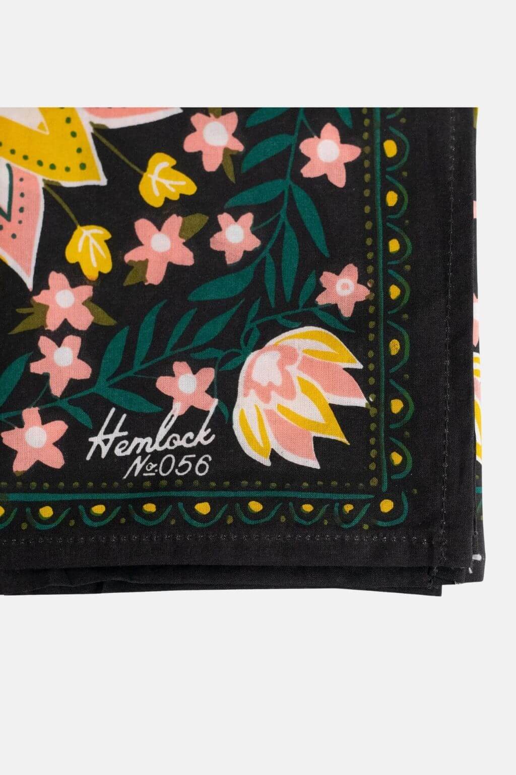 Hemlock Betty Bandana logo corner with pink and yellow floral detail
