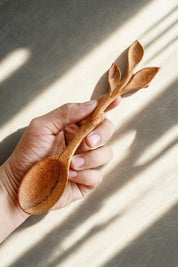 Close-up of Leaf Cluster Doussie Wood Spoon showing leaf-inspired handle detail.