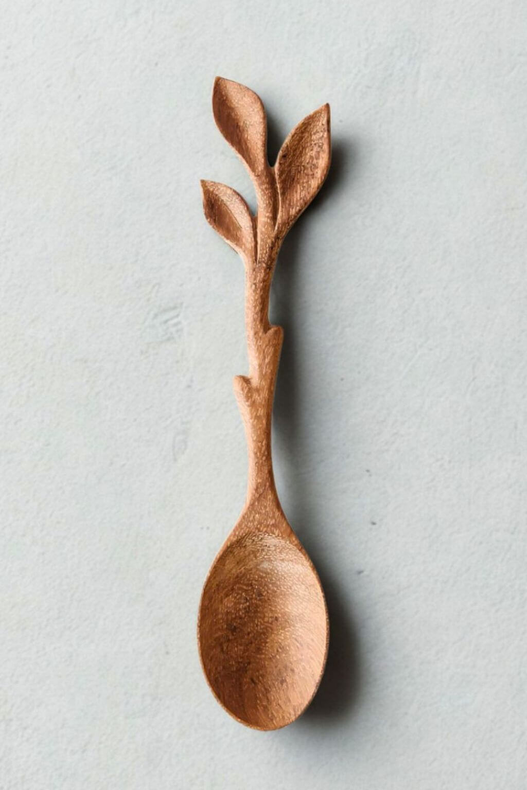 Leaf Cluster Doussie Wood Spoon hand-carved with branch handle, artisan kitchen utensil.