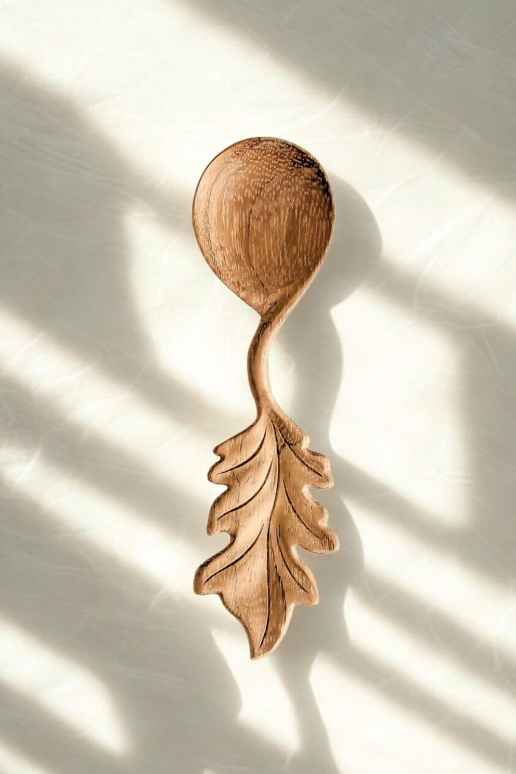 Artisan oak leaf wooden spoon carved from doussie wood