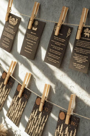 Set of Advent calendar cards hung on twine with clothespins, each printed with gold trees and daily mindfulness prompts.