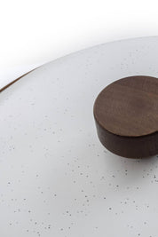 Close-up of walnut lid handle on eggshell enamel stock pot