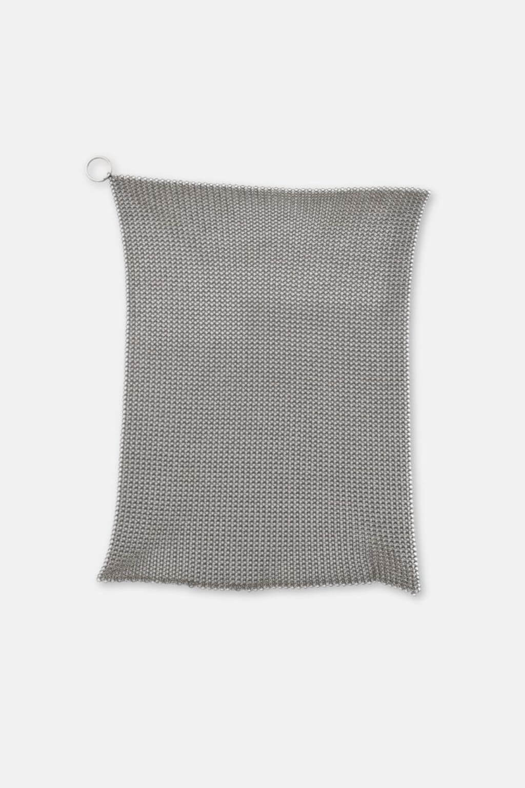 Fine stainless steel cleaning mesh laid flat against white surface