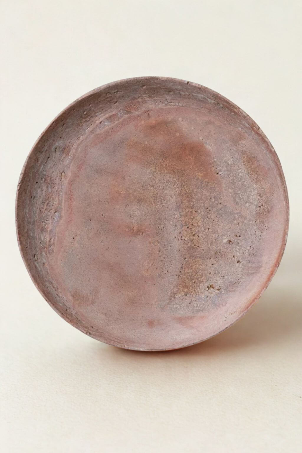 Natural red travertine stone tray with soft earthy tones and organic texture.