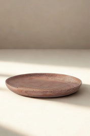 Natural red travertine stone tray with soft earthy tones and organic texture.