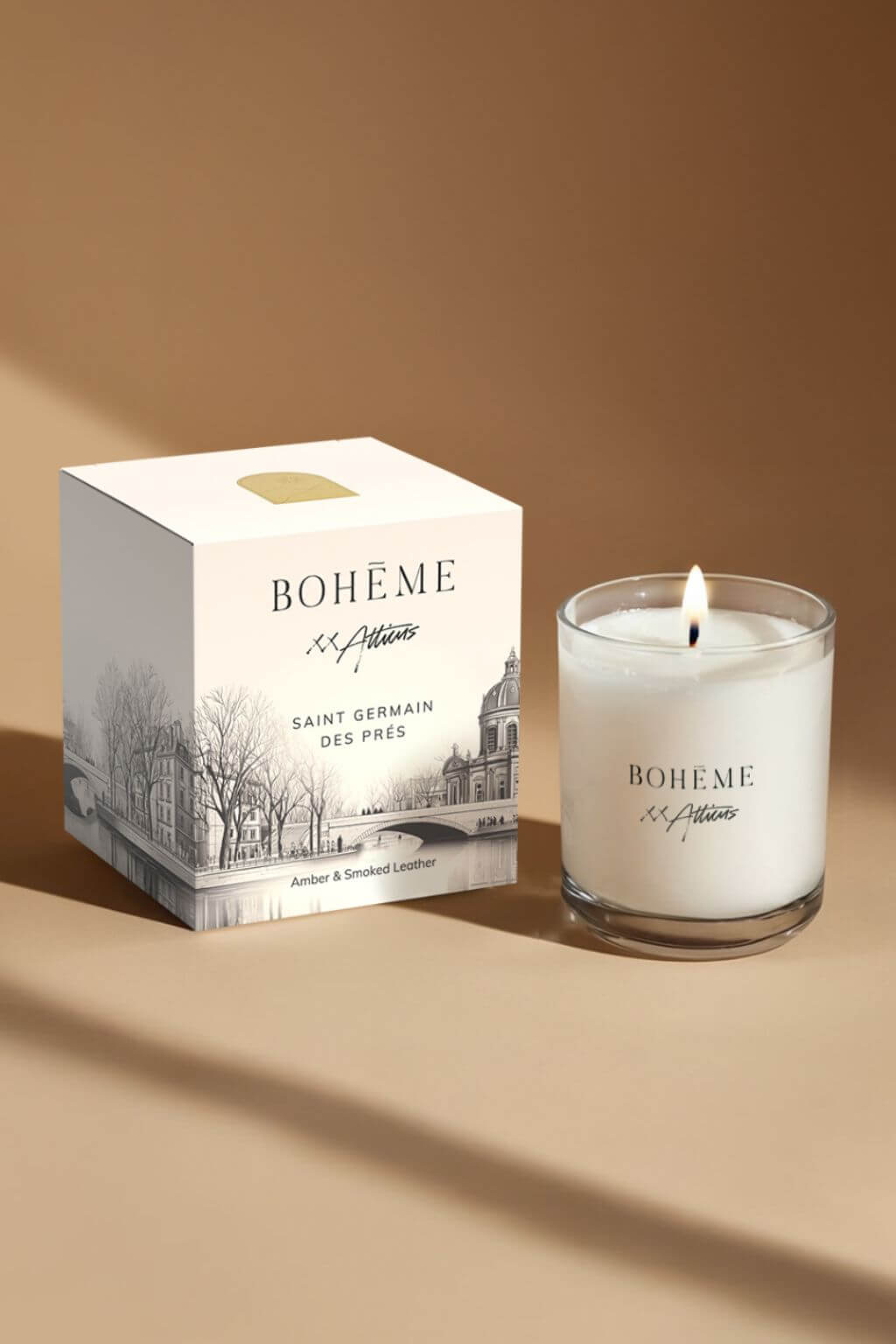 Bohème Saint-Germain-des-Prés candle and box styled together in warm light, evoking Parisian evenings