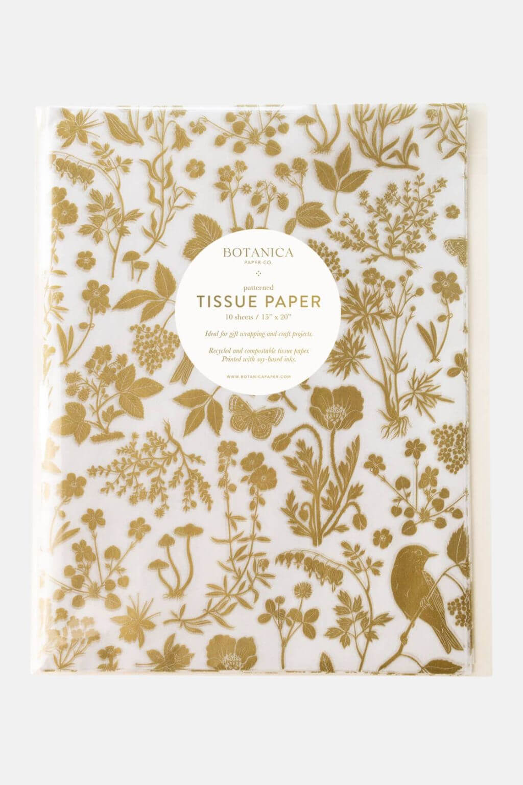 Gold meadow botanical tissue paper by Botanica Paper Co. folded in clear sleeve with golden floral print.