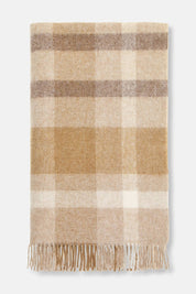 Folded British lambswool throw in natural contemporary check pattern