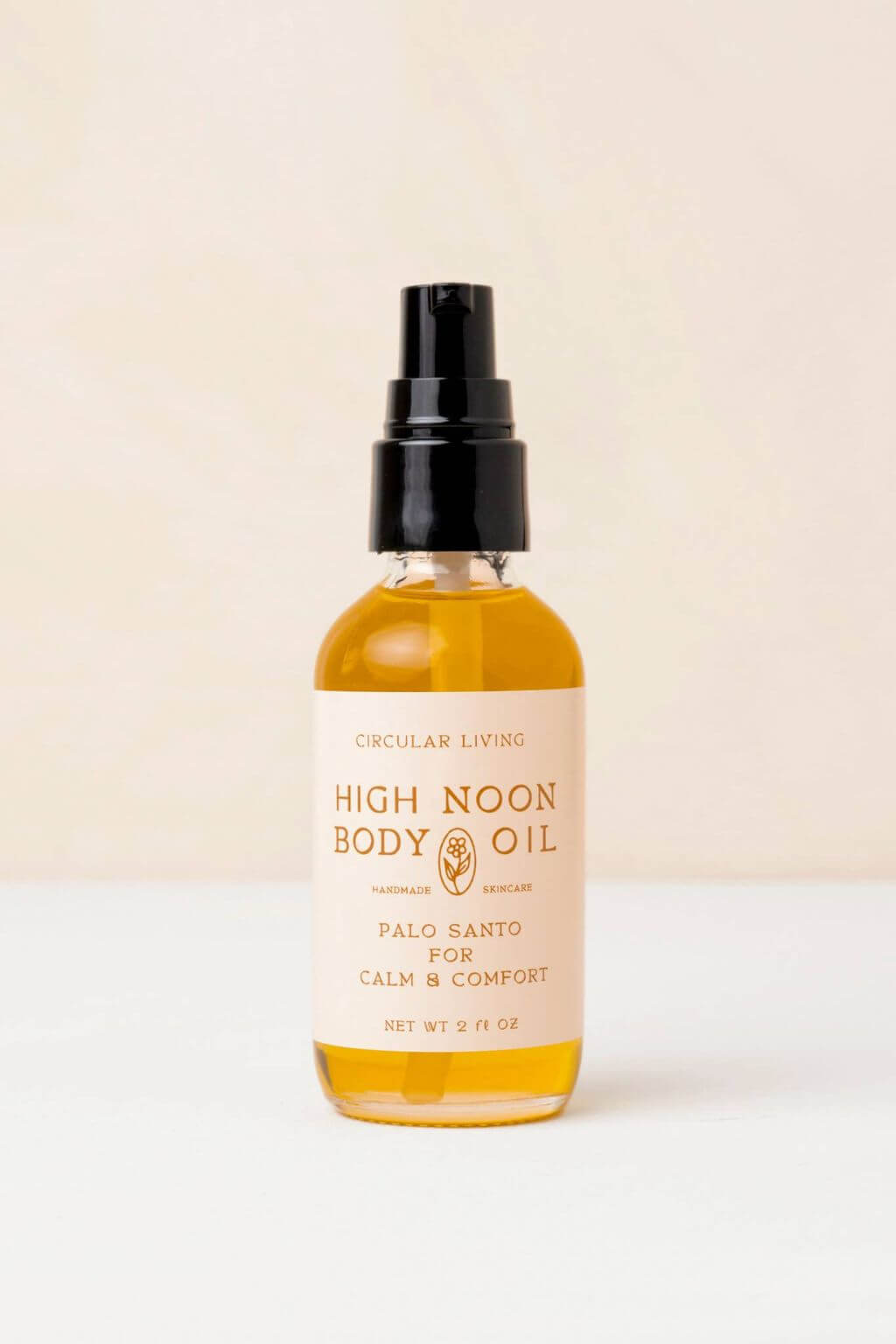 Circular Living High Noon Body Oil bottle with black pump, palo santo skincare ritual