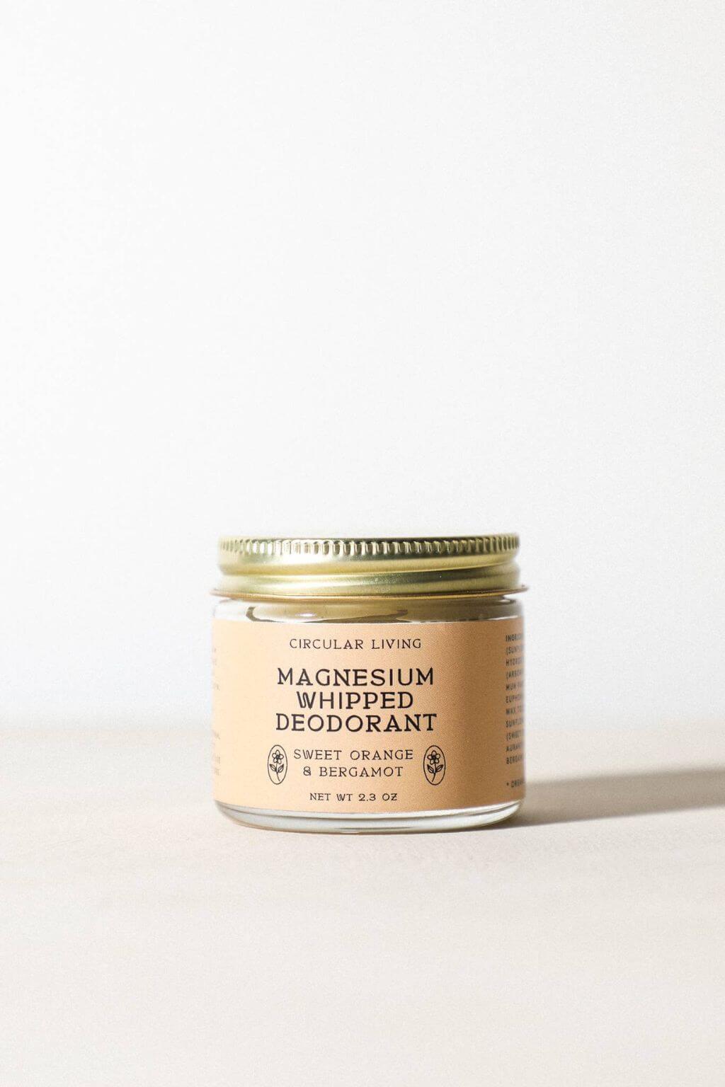 Magnesium Whipped Deodorant jar on neutral backdrop, sweet orange and bergamot scent