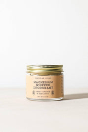Magnesium Whipped Deodorant jar on neutral backdrop, sweet orange and bergamot scent