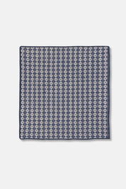 Close-up of woven dishcloth in midnight blue and cream pattern, made from cotton.