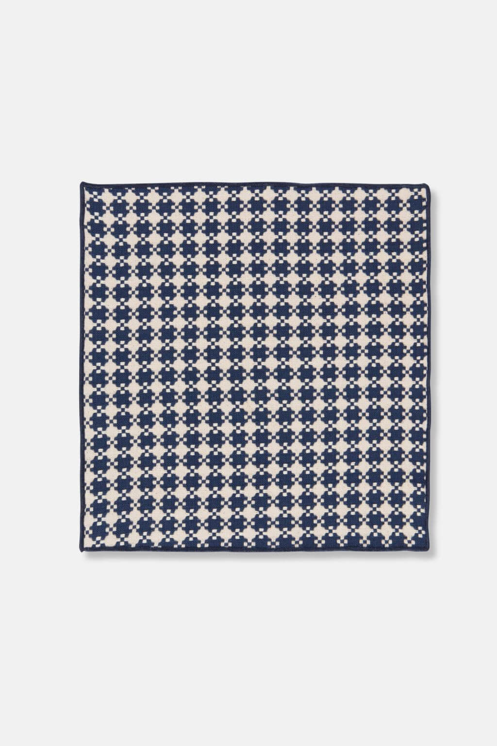 Close-up of woven dishcloth in midnight blue and cream pattern, made from cotton.