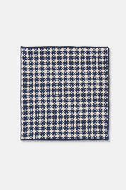 Close-up of woven dishcloth in midnight blue and cream pattern, made from cotton.