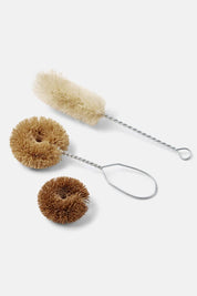 Three children’s dish brushes on white background