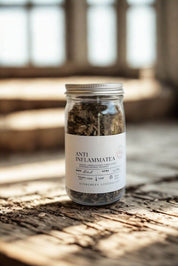 Anti-Inflammatea jar photographed on rustic wooden table in warm natural light