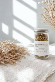 Lymphatic Tea jar displayed with dried grasses on soft neutral fabric