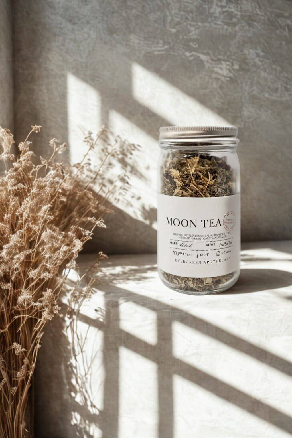 Moon Tea jar from Evergreen Apothecary styled with dried florals and warm natural light
