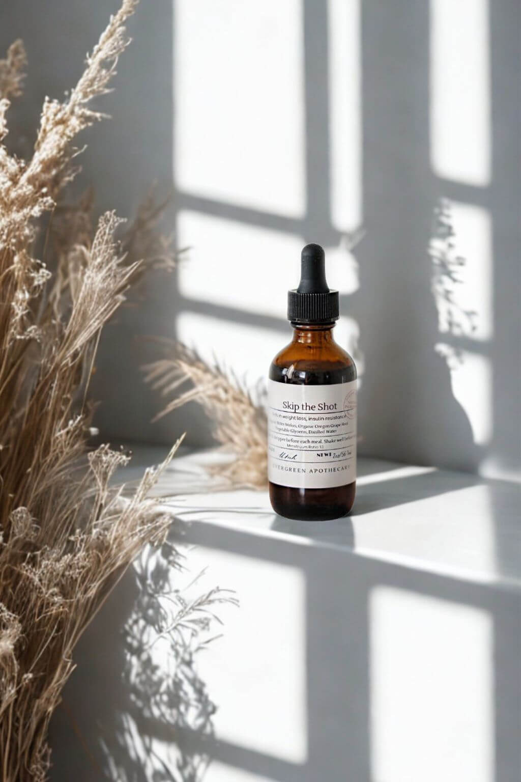 Herbal tincture Skip the Shot with dried grasses and shadows in natural light