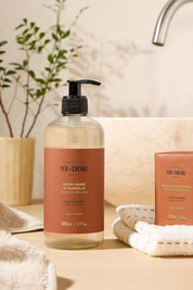 Fer à Cheval Orange Blossom Marseille Liquid Soap bottle with matching bar soap beside sink.