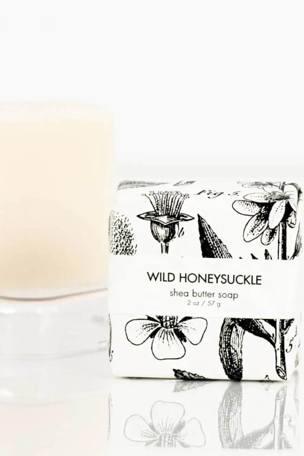 Close-up of Formulary 55 petite soap with floral illustrations on wrapper.