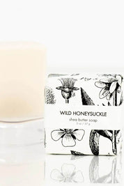 Close-up of Formulary 55 petite soap with floral illustrations on wrapper.