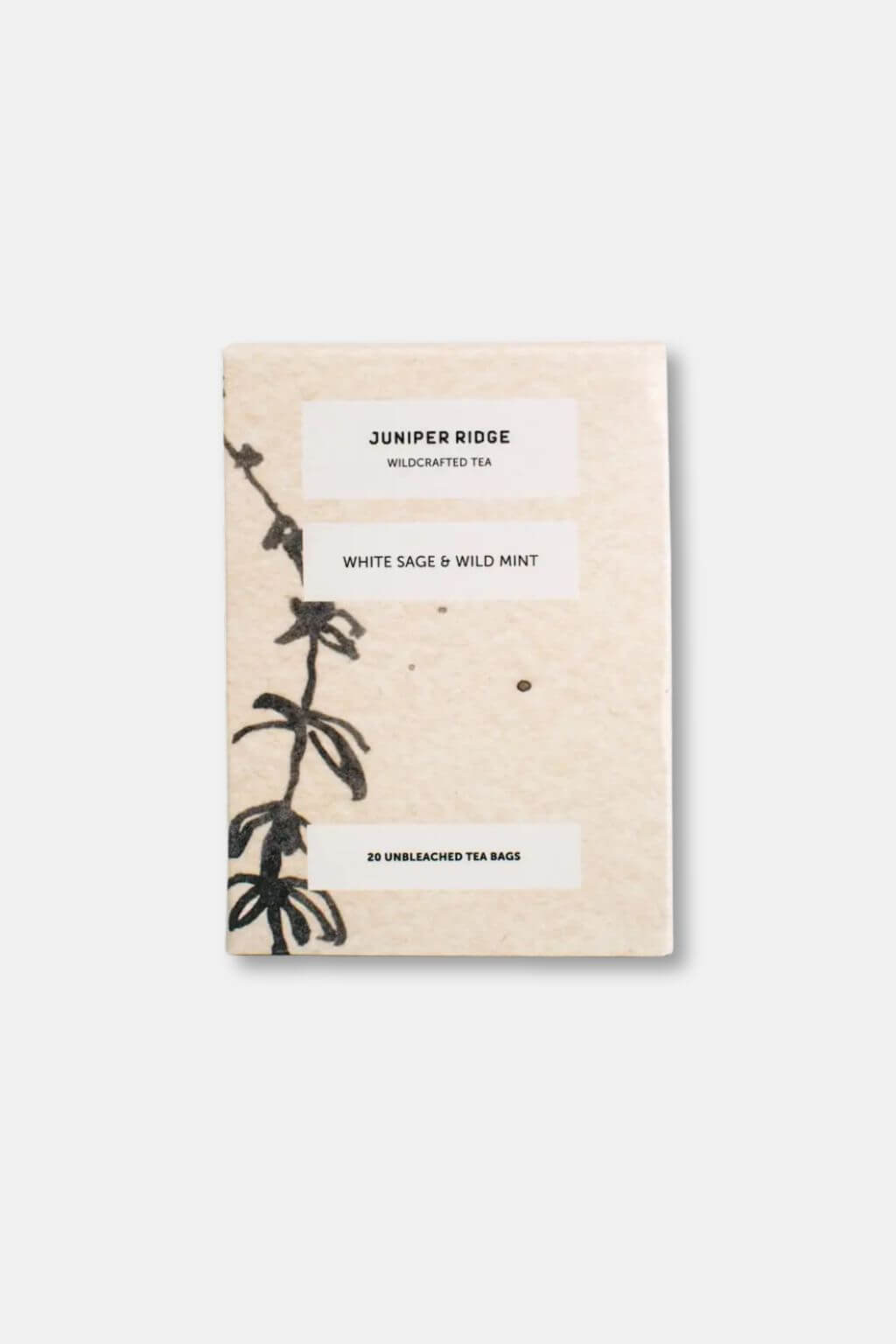 Juniper Ridge Wildcrafted Tea package with botanical design on a white background