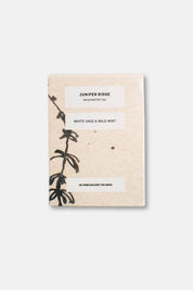 Juniper Ridge Wildcrafted Tea package with botanical design on a white background
