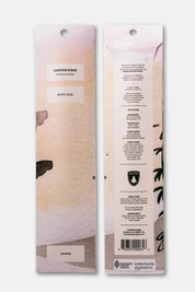 Front and back packaging designs side by side with floral and text elements.