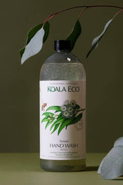 Koala Eco Natural Hand Wash Refill Bottle with botanical label and leaves in the background
