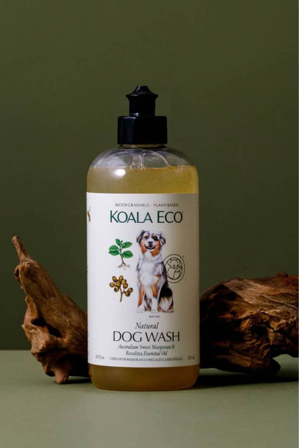 Koala Eco Natural Dog Wash bottle on a green background