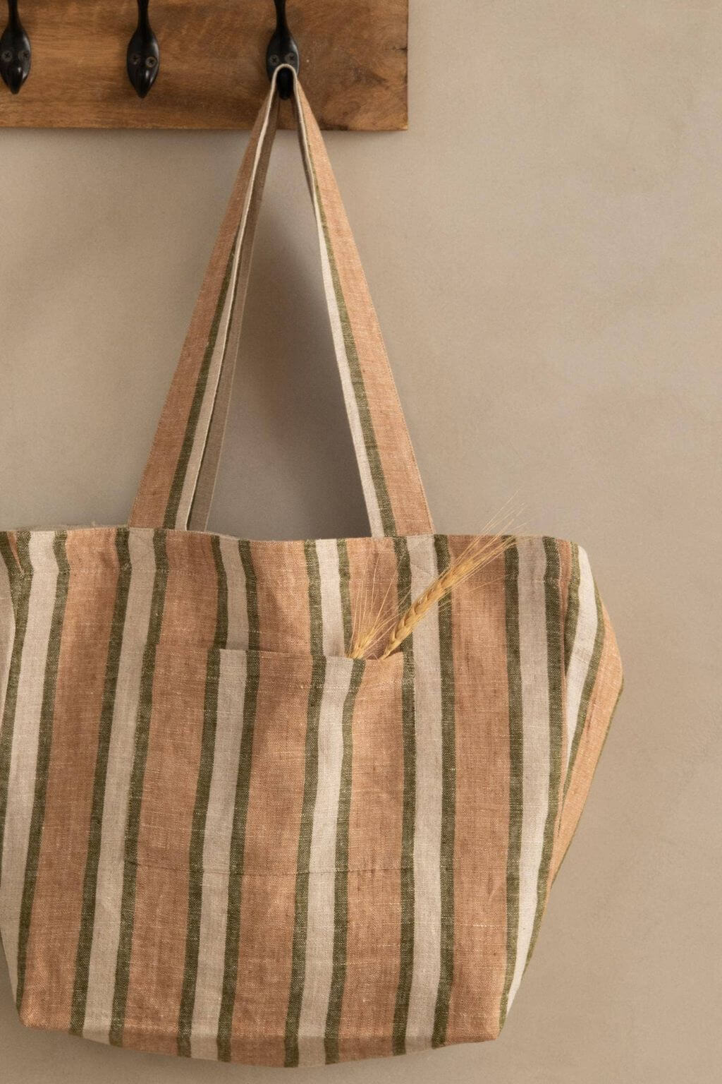 Sylph Striped Linen Market Bag styled on wall hook in rustic interior