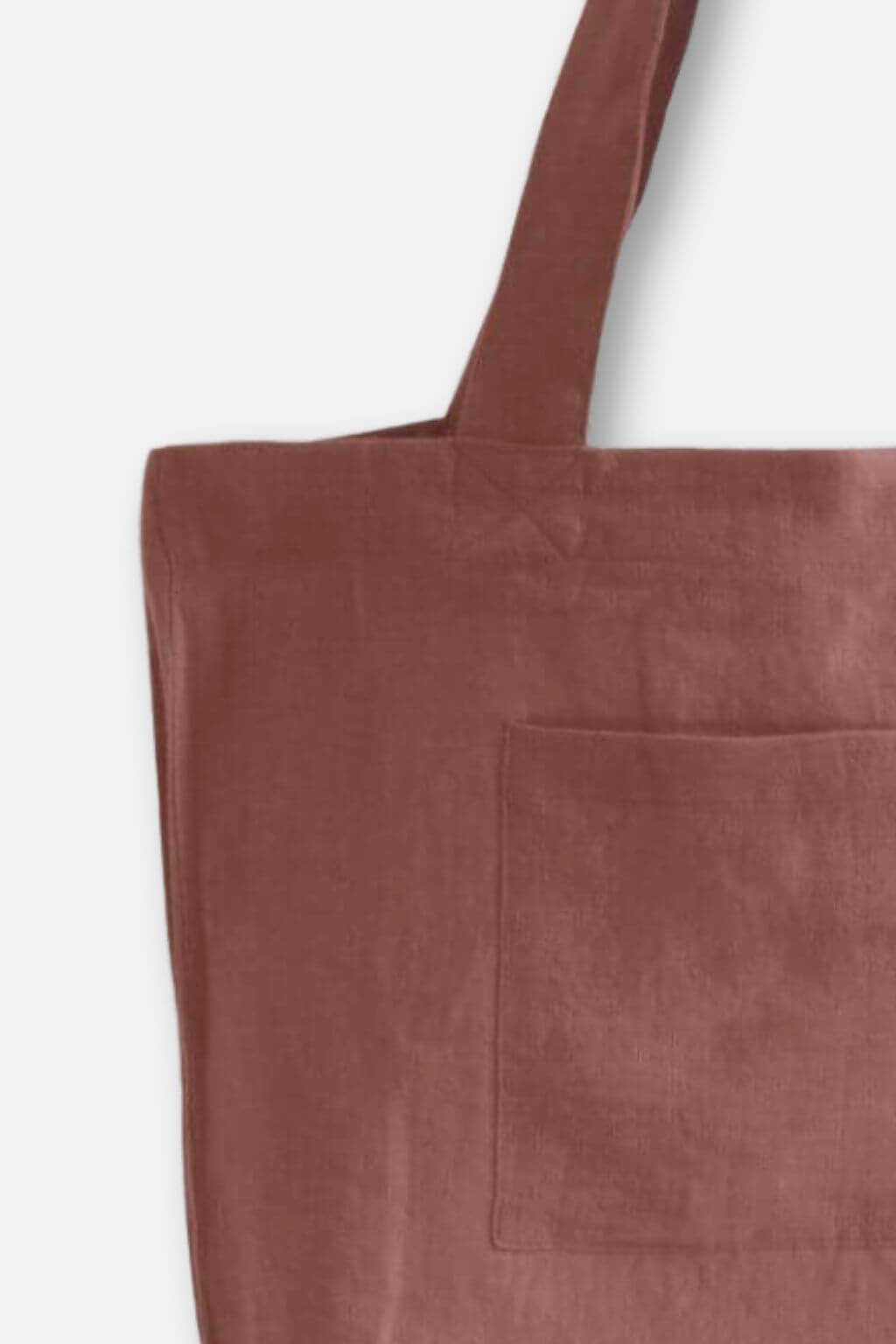 Close-up of cinnamon brown linen tote bag texture and handle