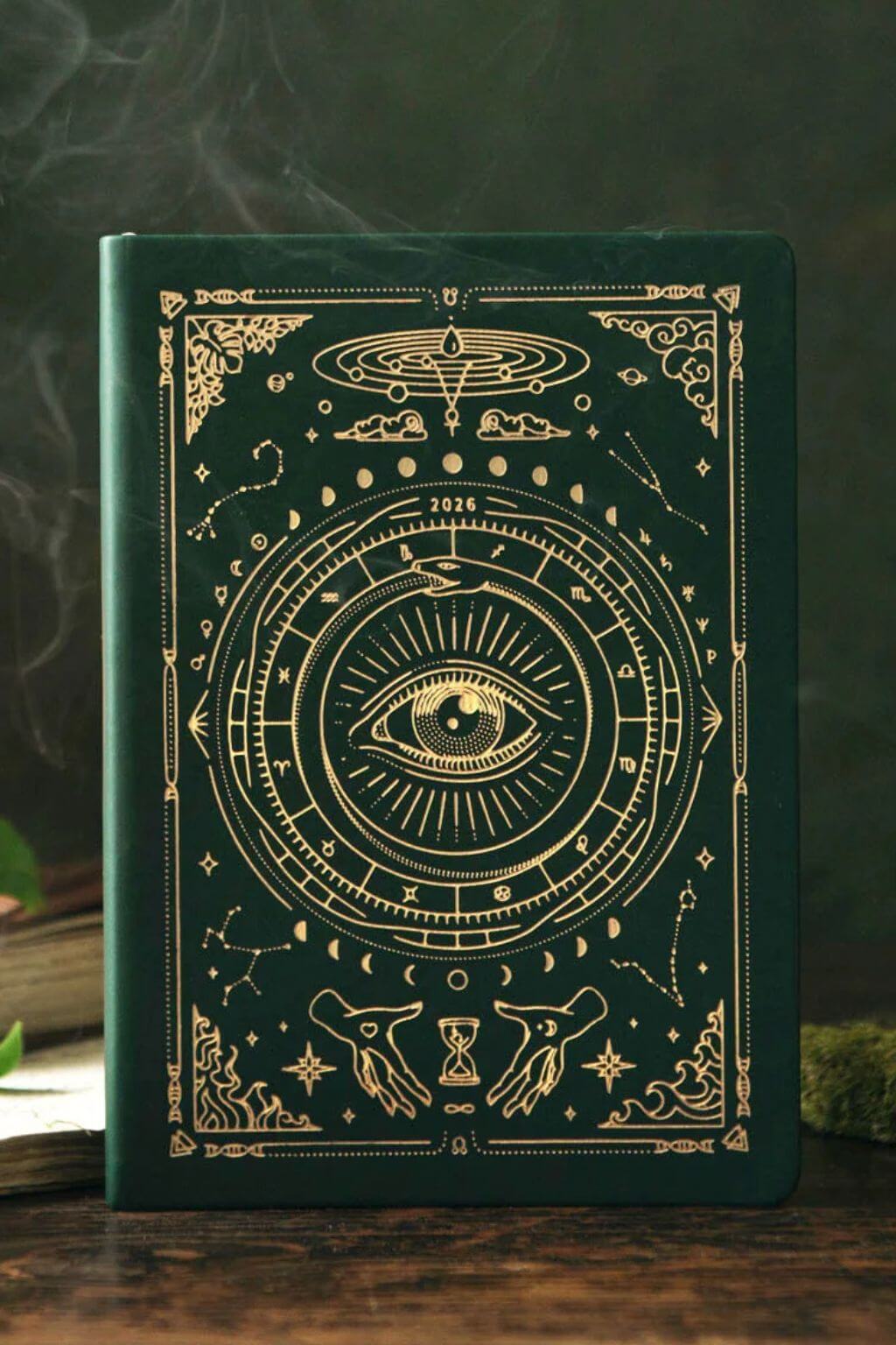 Magic of I 2026 planner cover in Deep Moss with holographic gold foil and celestial eye motif