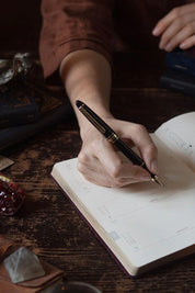 Magic of I 2026 planner interior featuring monthly astrology overview and moon phases