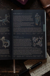 Dark interior astrology spread featuring Pisces artwork