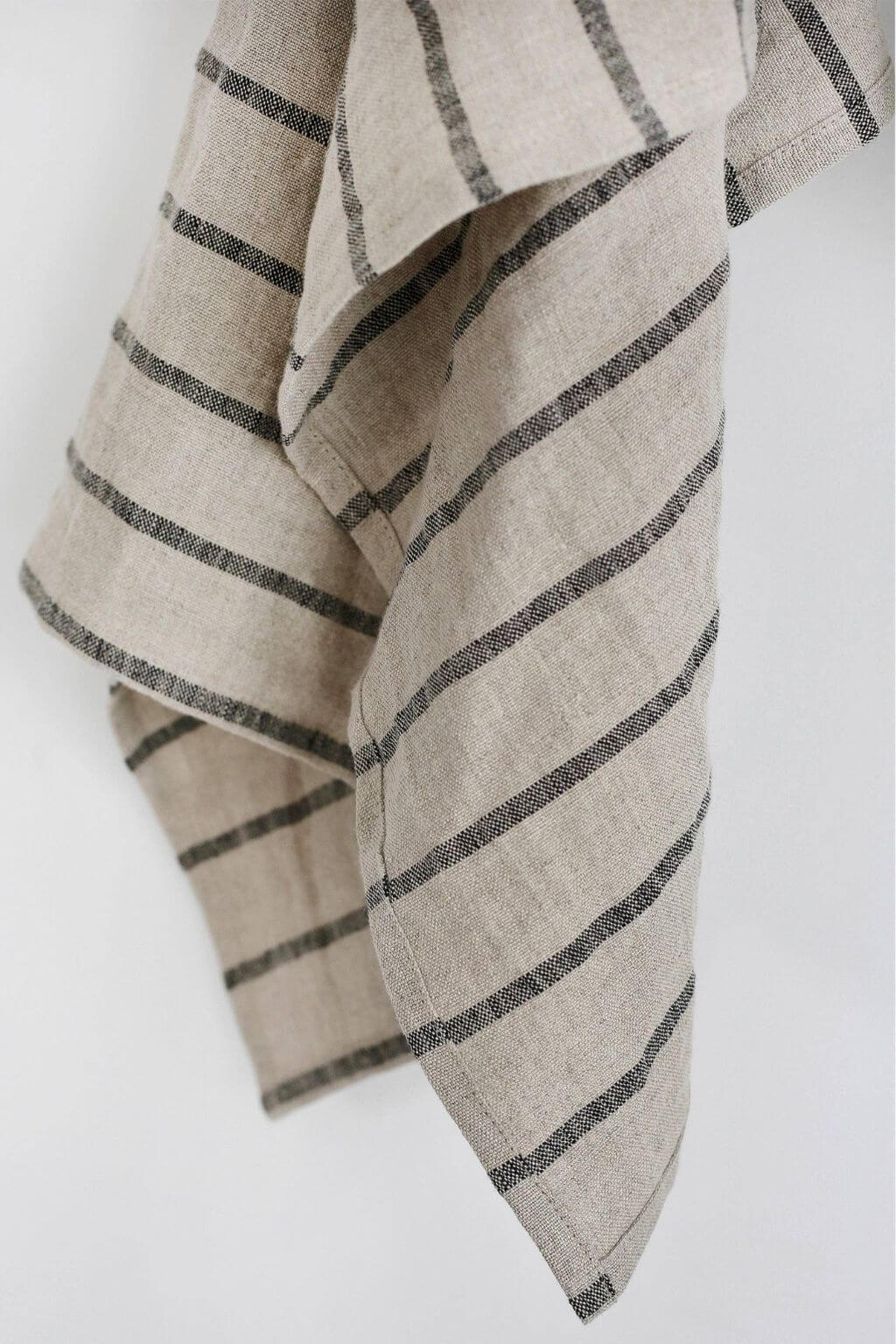 Close-up of black striped natural linen towel texture