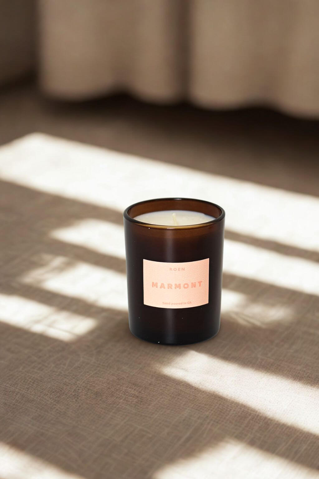 Marmont candle displayed on linen