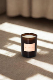Marmont candle displayed on linen