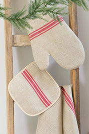 Linen oven mitt with red stripe hanging on ladder